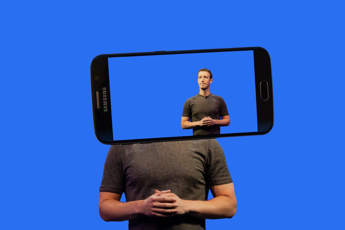 An image of Mark Zuckerberg inside the screen of a smartphone.