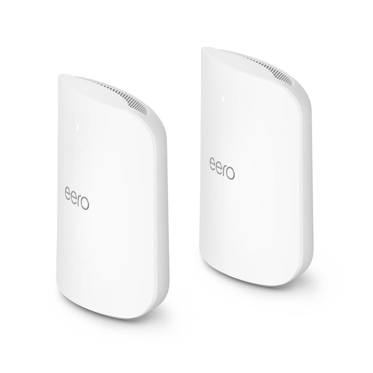 Two Eero Max 7 mesh router devices sit beside each other in profile against a white background.