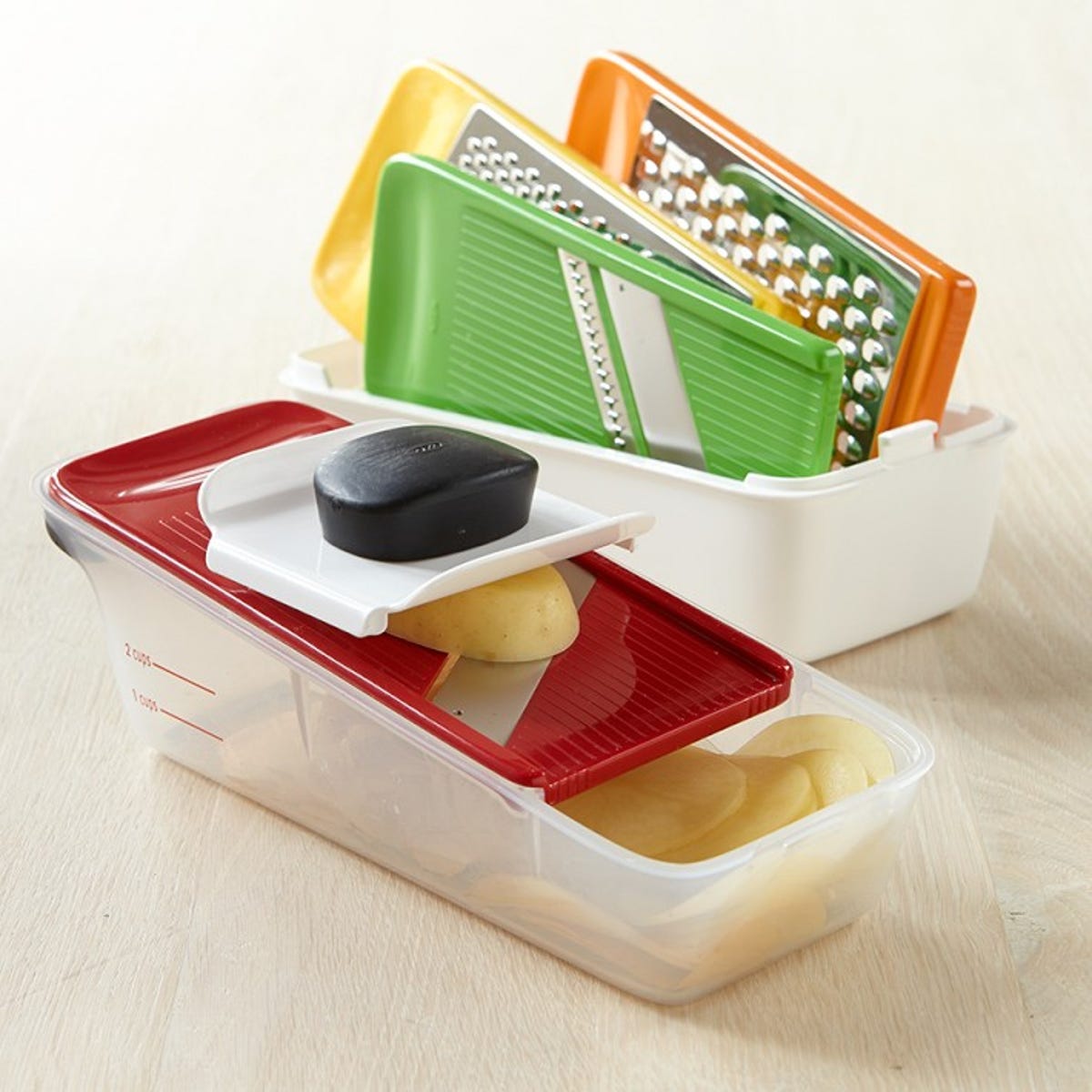 Put the family to work with the OXO Good Grips Complete Grate & Slice Set.