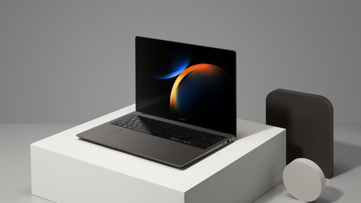 Samsung Galaxy Book 3 Ultra 16-inch laptop, open and facing partly to the left and sitting on a white surface.