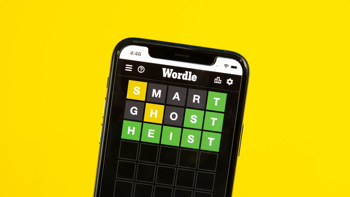 Wordle on a smartphone screen against a yellow background