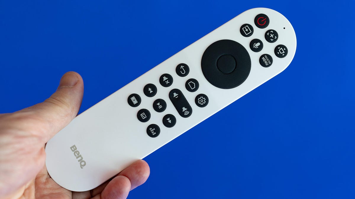 The main remote of the BenQ TK860i on a blue background.