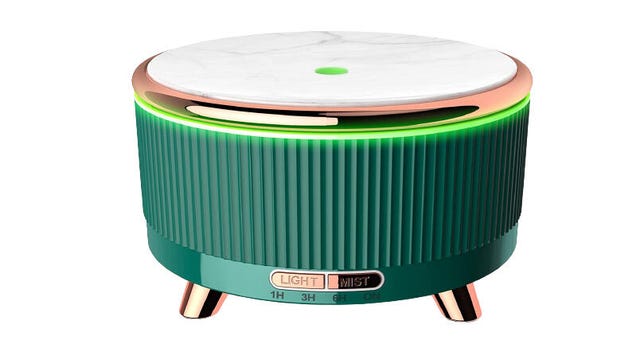 Small green oil diffuser with gold trim