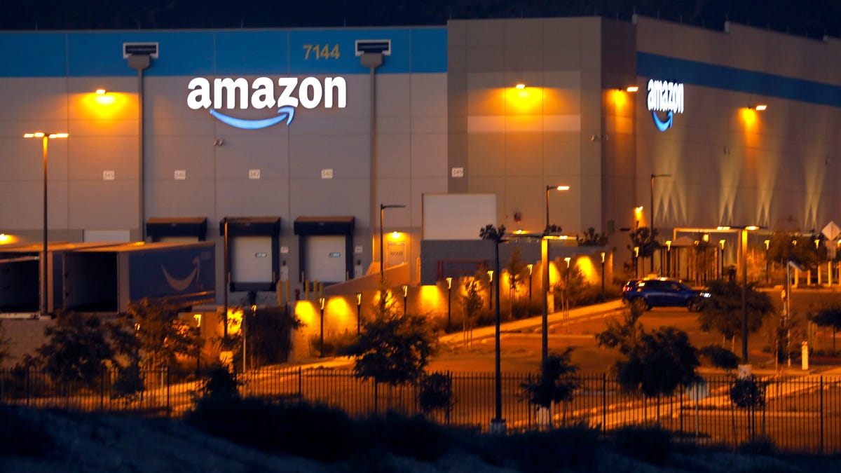 Amazon fulfillment center from the outside at night