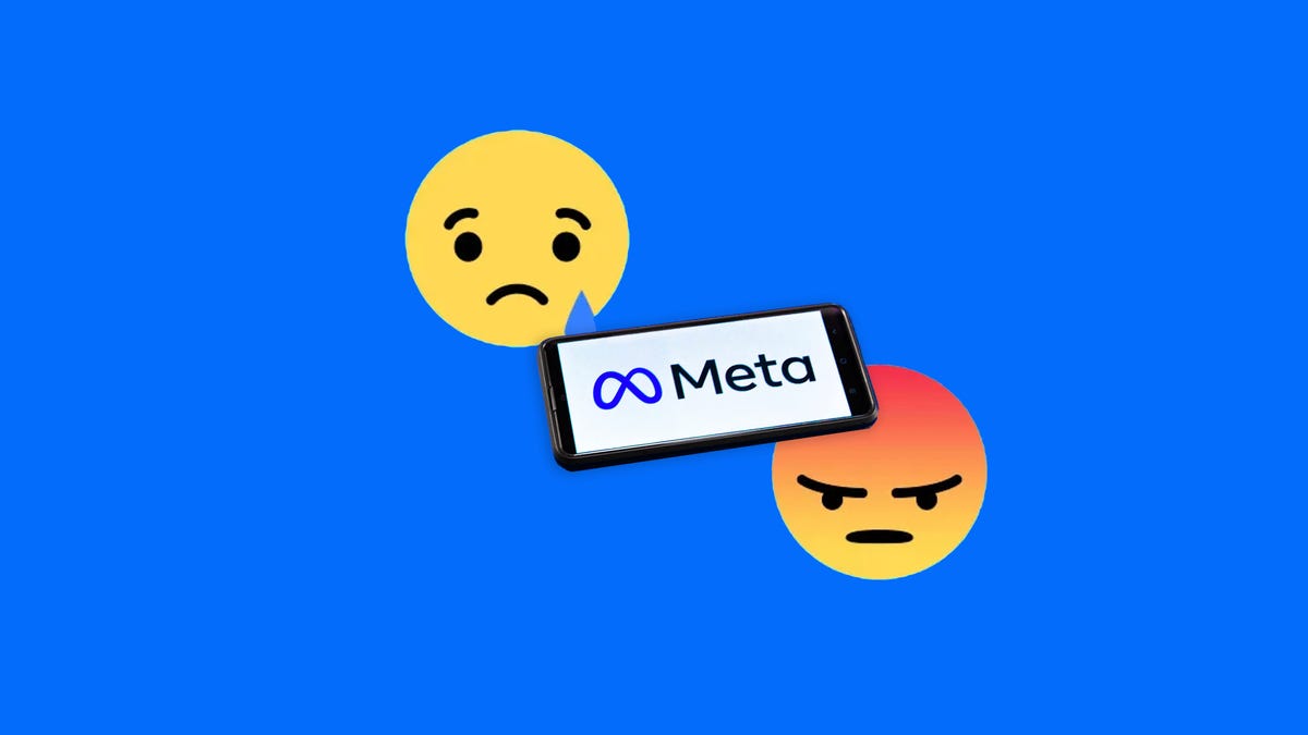 Meta logo on a phone with Facebook sad and angry reaction emoji