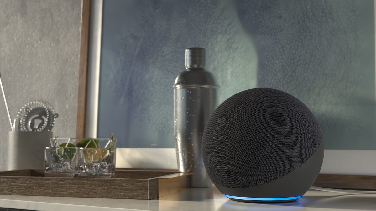 A Black Amazon Echo smart speaker on a kitchen counter