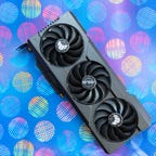 The Asus TUF GeForce RTX 4070 Ti OC lying fans up on a multicolor background