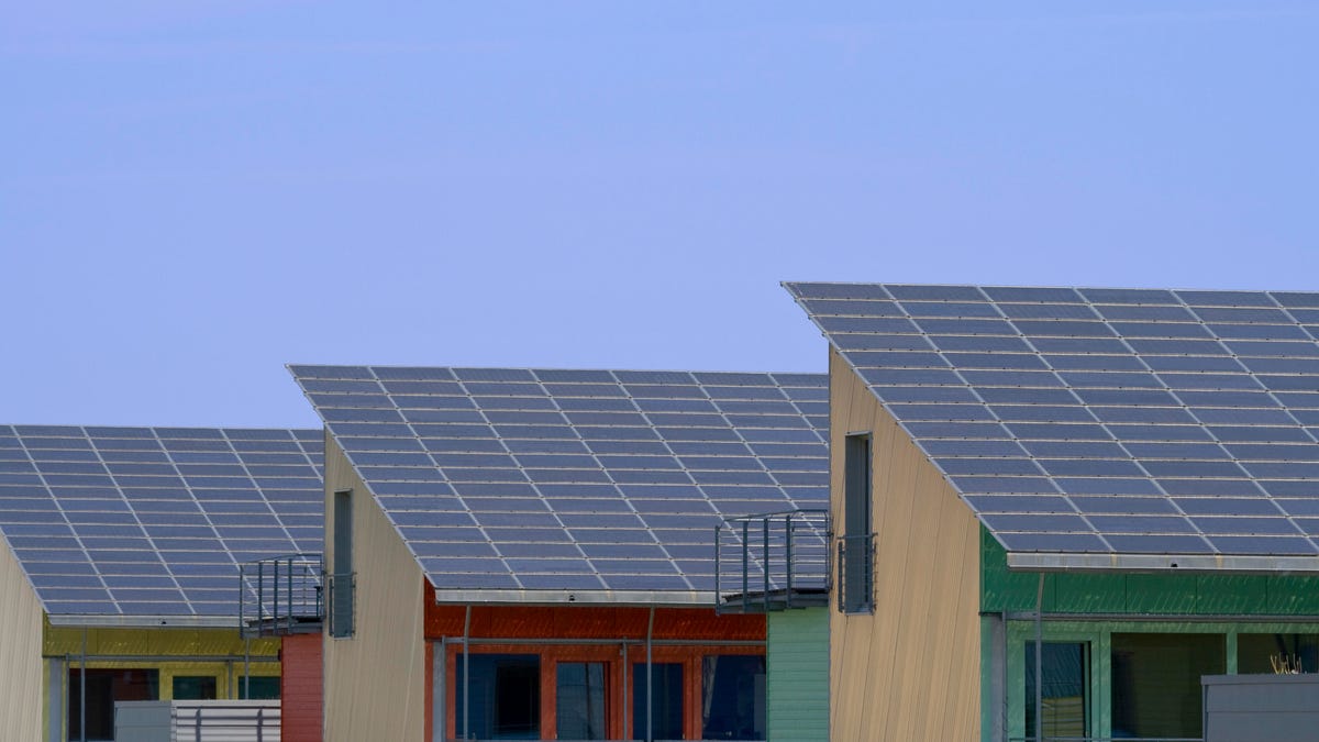 Solar panels on three houses in a row.