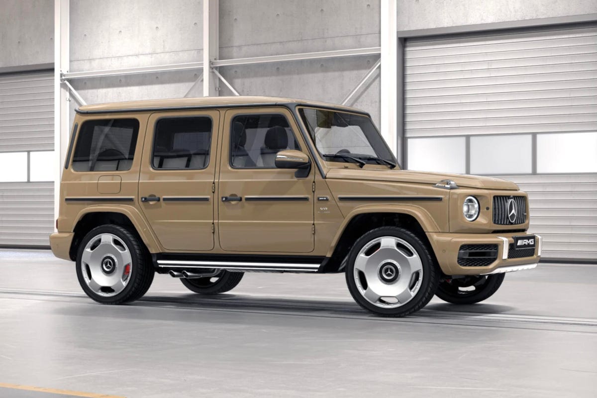Front 3/4 view of a beige Mercedes-AMG G63 showing new monoblock wheels