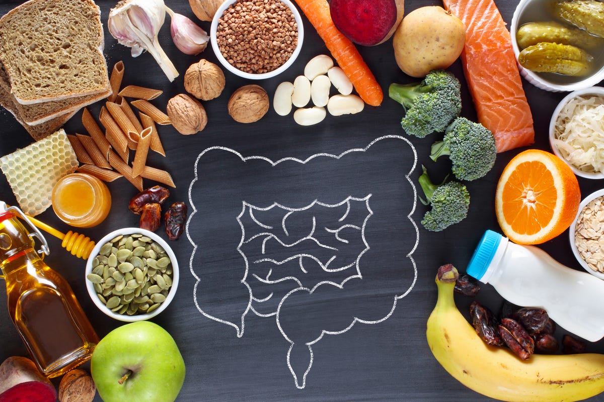 A sketch of the intestines surrounded by healthy foods