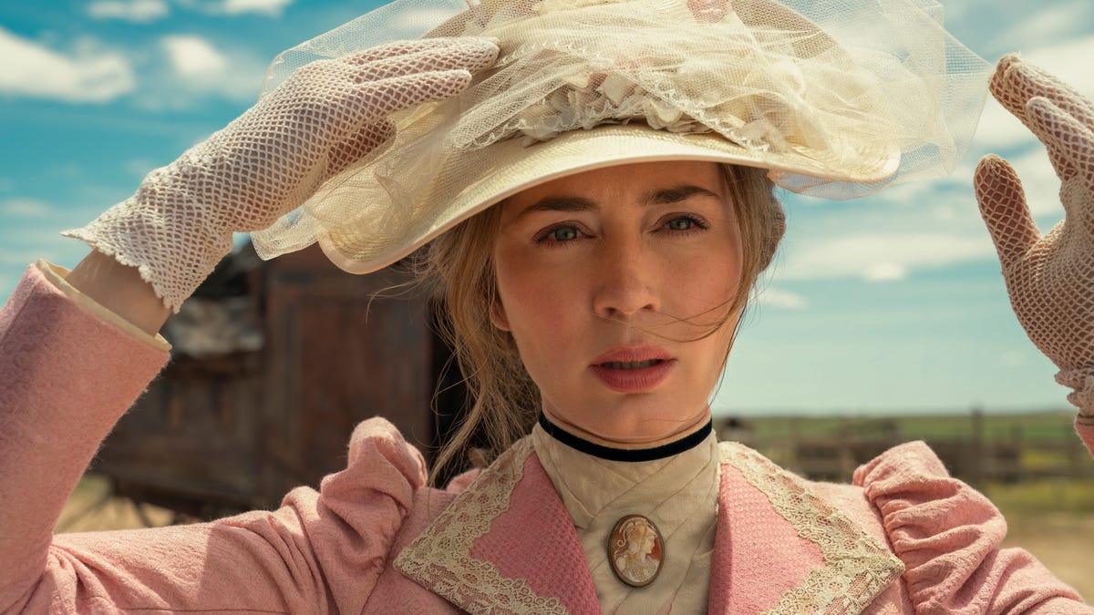 Close up of Emily Blunt as Cornelia Locke, wearing a pink dress out in the desert