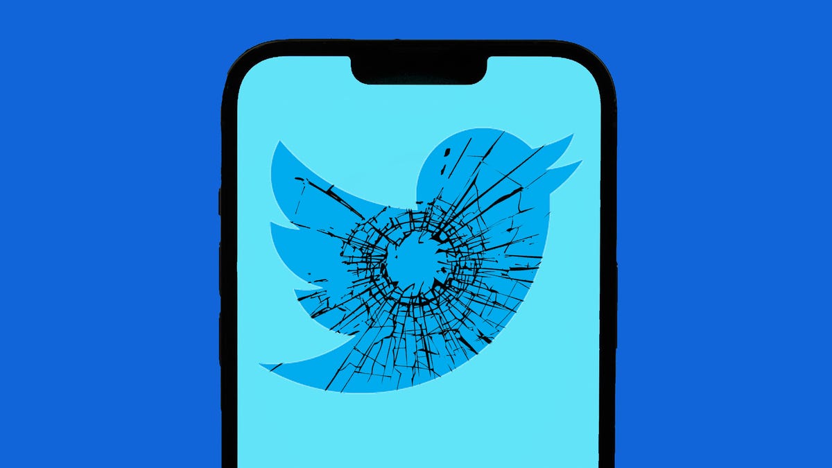 The Twitter logo on a broken phone screen