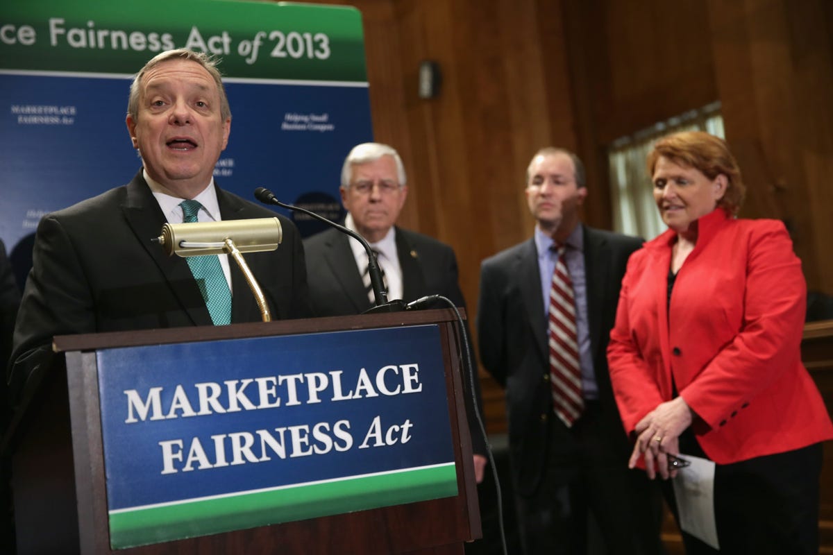 Senate Majority Whip Richard Durbin (D-IL) (left) touts S.743 during a press conference on Capitol Hill last month. Sen. Mike Enzi (R-WY) is second from the left.