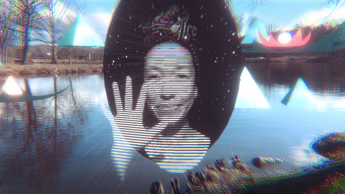 A woman looks through a digital portal with her palm outstretched, while small pyramids appear to float over a glitchy lake scene in the background.