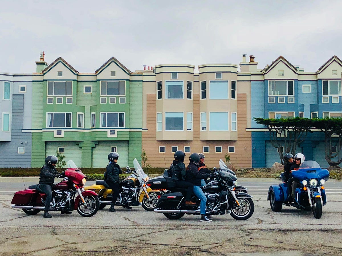 A group of motorcycles stops along the Great Highway in San Francisco.