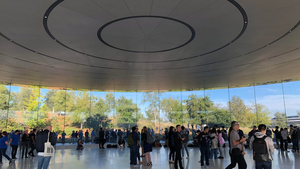 A crowd of people gathers in Apple's spaceship building