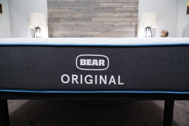 The Bear Original mattress on a bed frame in a brightly lit bedroom