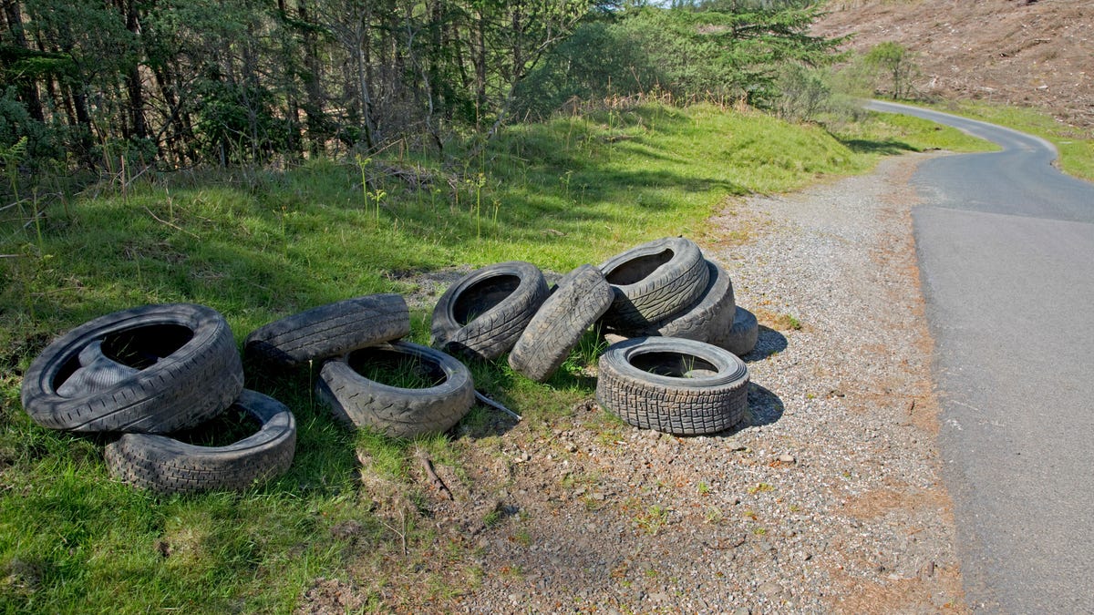 Used tyres dumped at roadside flytipping Isle of Mull Scotland