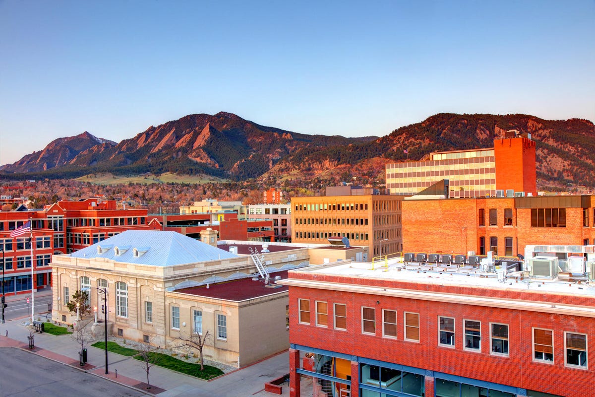 Downtown Boulder, Colorado, surrounded by the Flatiron Mountains.