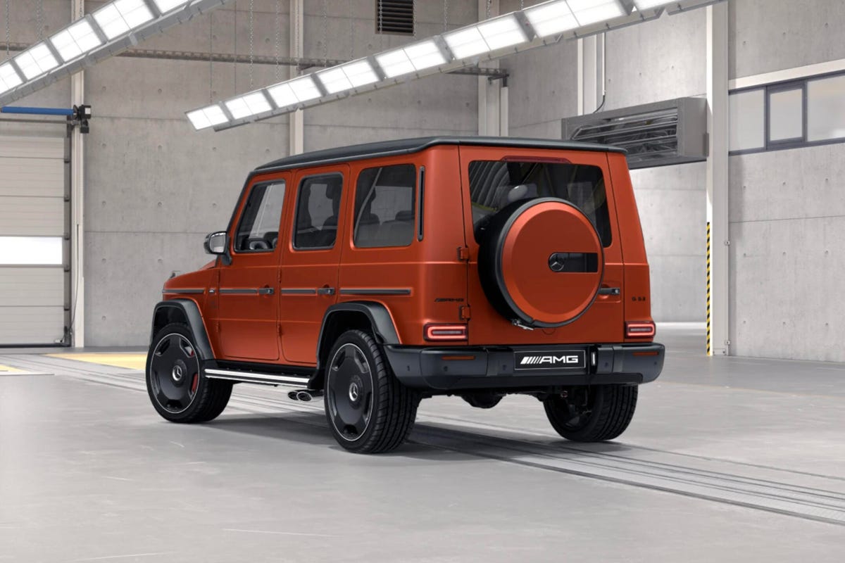 Rear 3/4 view of an orange Mercedes-AMG G63 showing new monoblock wheels