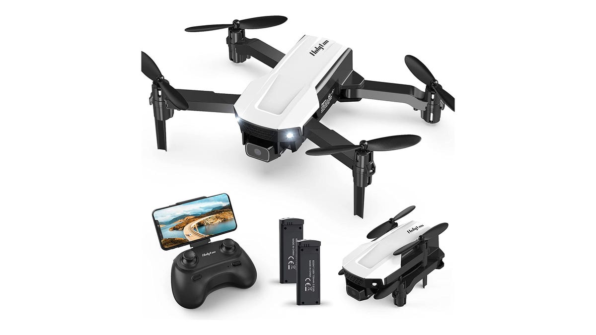 A black and white mini drone is shown fully extended and also folded. A controller paired with a smartphone and two batteries