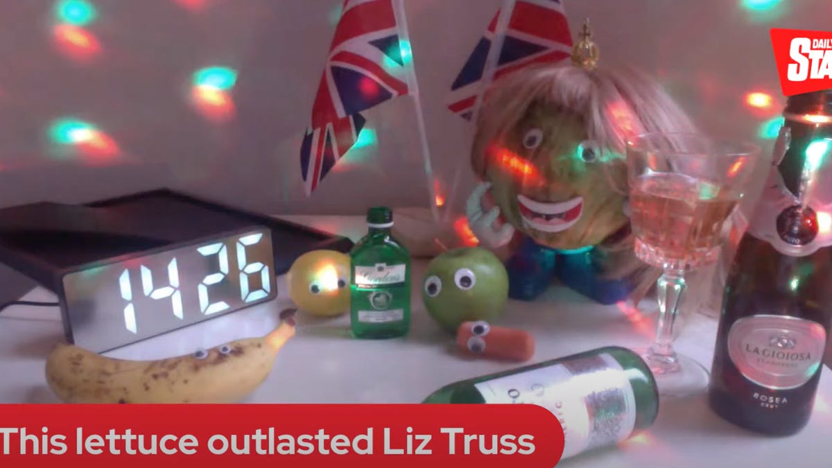 Various fruits and vegetables, champagne bottles, UK flags and a digital clock