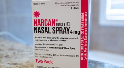 box with logo for Narcan brand Naloxone nasal spray on a countertop