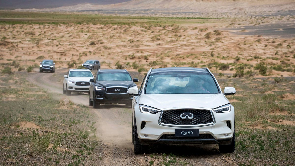 Infiniti SUVs in the Gobi Desert