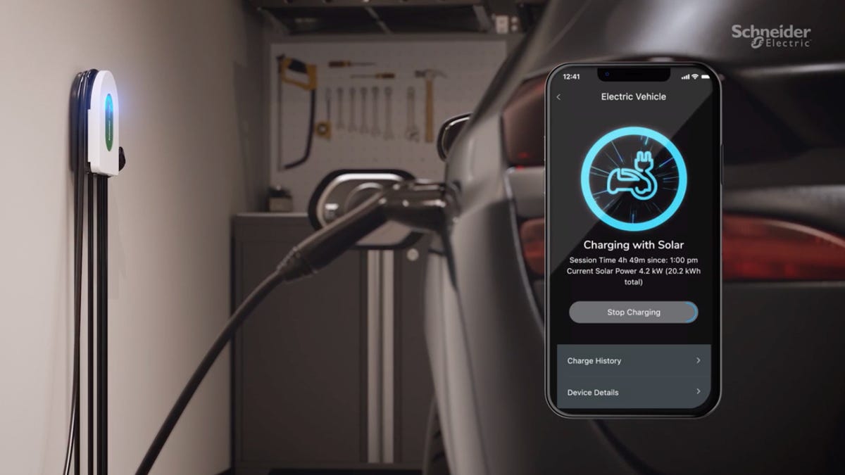 An electric vehicle charging and the Schneider Home app
