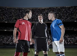 Getty Images Soccer players facing each other on field