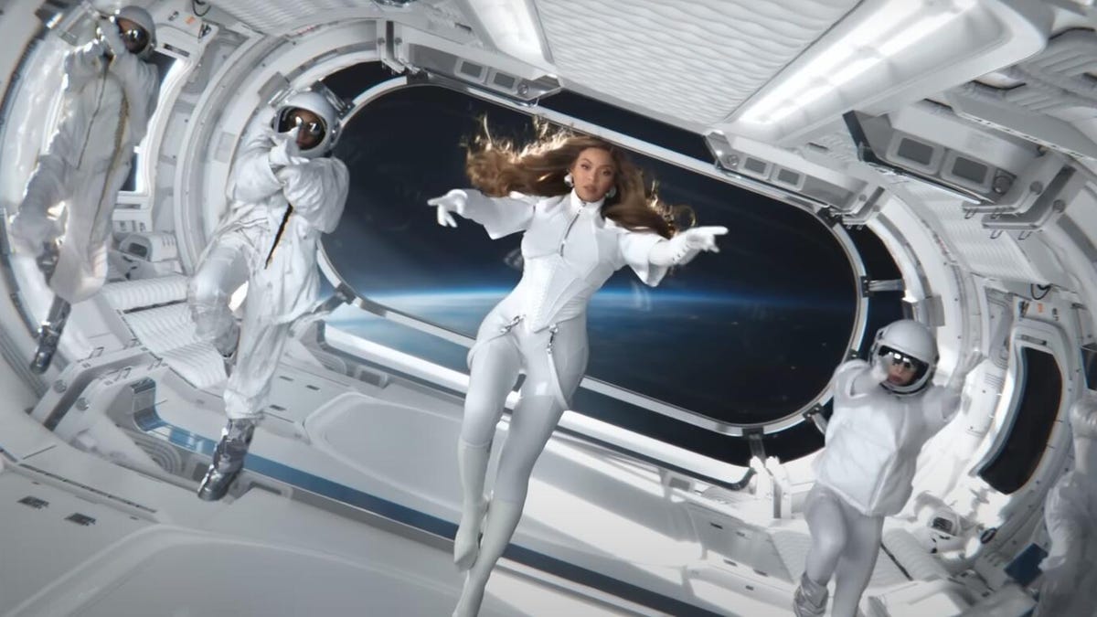 beyonce floats in a rocket ship with astronauts