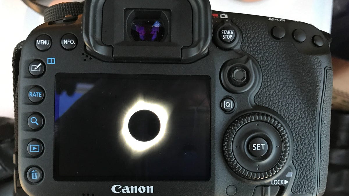 Solar eclipse photo in a camera&apos;s viewing screen.