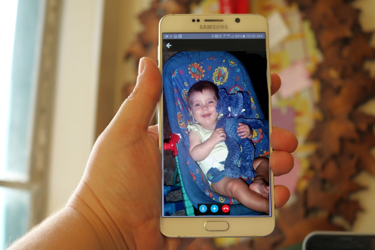 Android phone displaying a child's photo