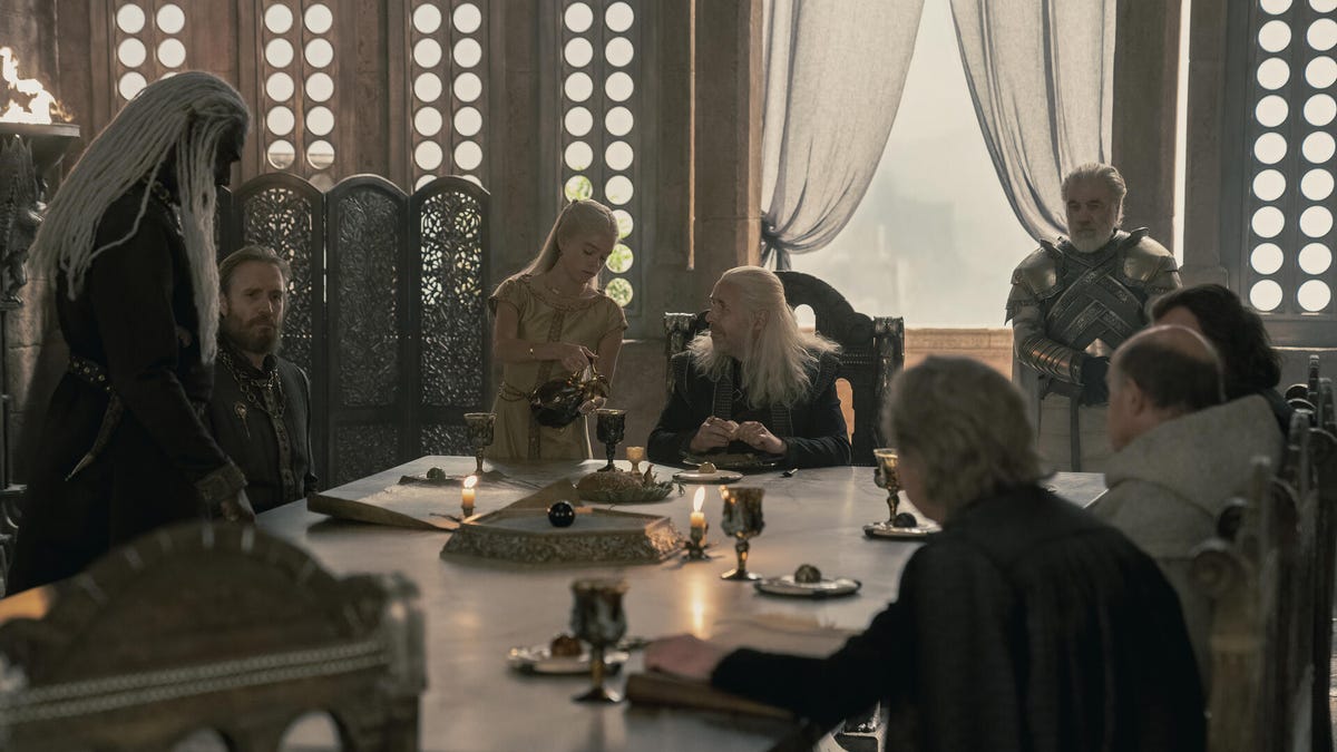 The members of the Small Council convene, with Princess Rhaenyra pouring everyone wine