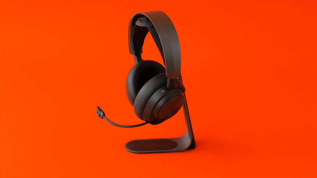 SteelSeries Arctis Nova Pro wireless gaming headset hanging on headset stand
