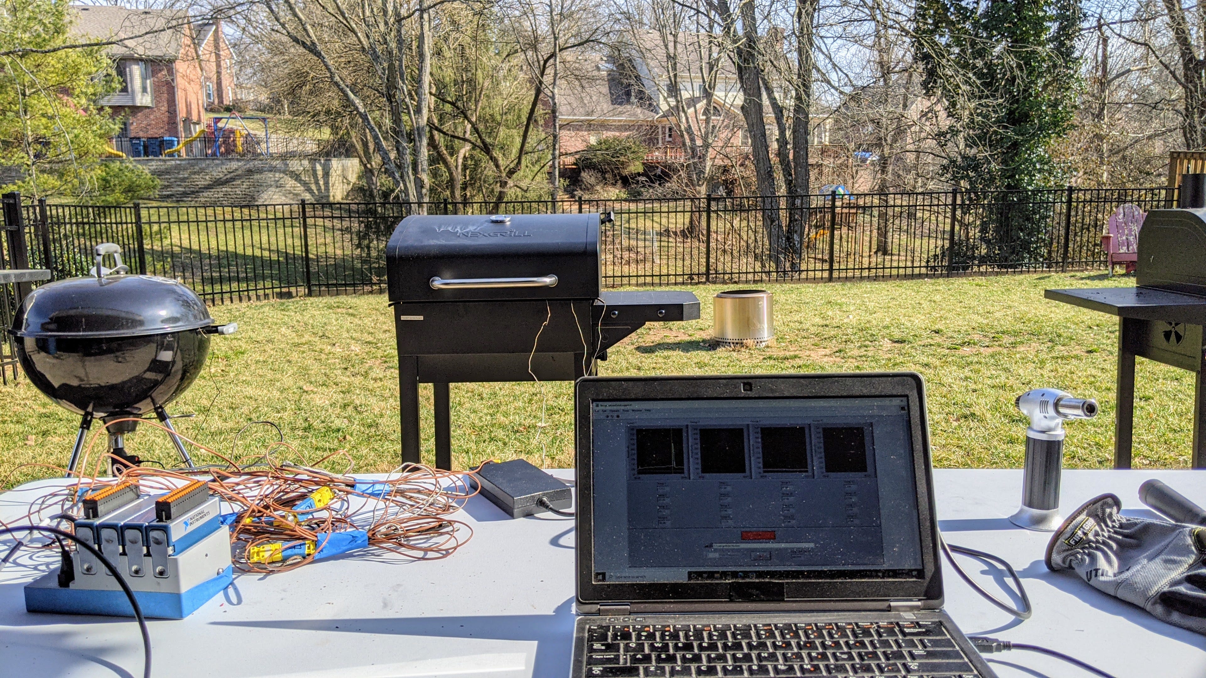 How we test grills: Four grills in an outdoor setting