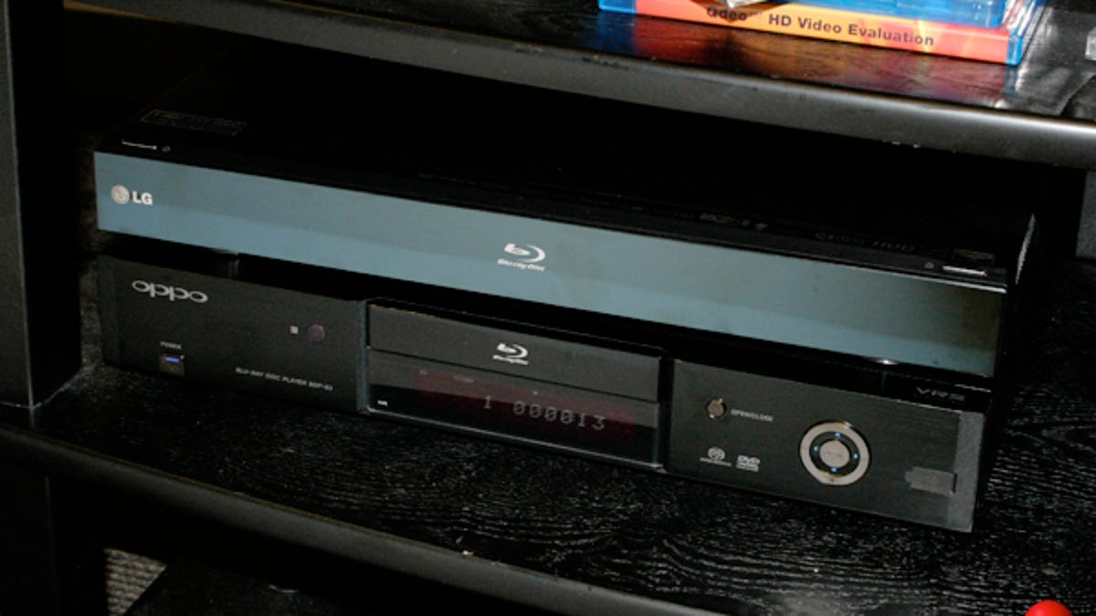 LG&apos;s BD590, stacked on top of our reference Oppo BDP-83 Blu-ray player.