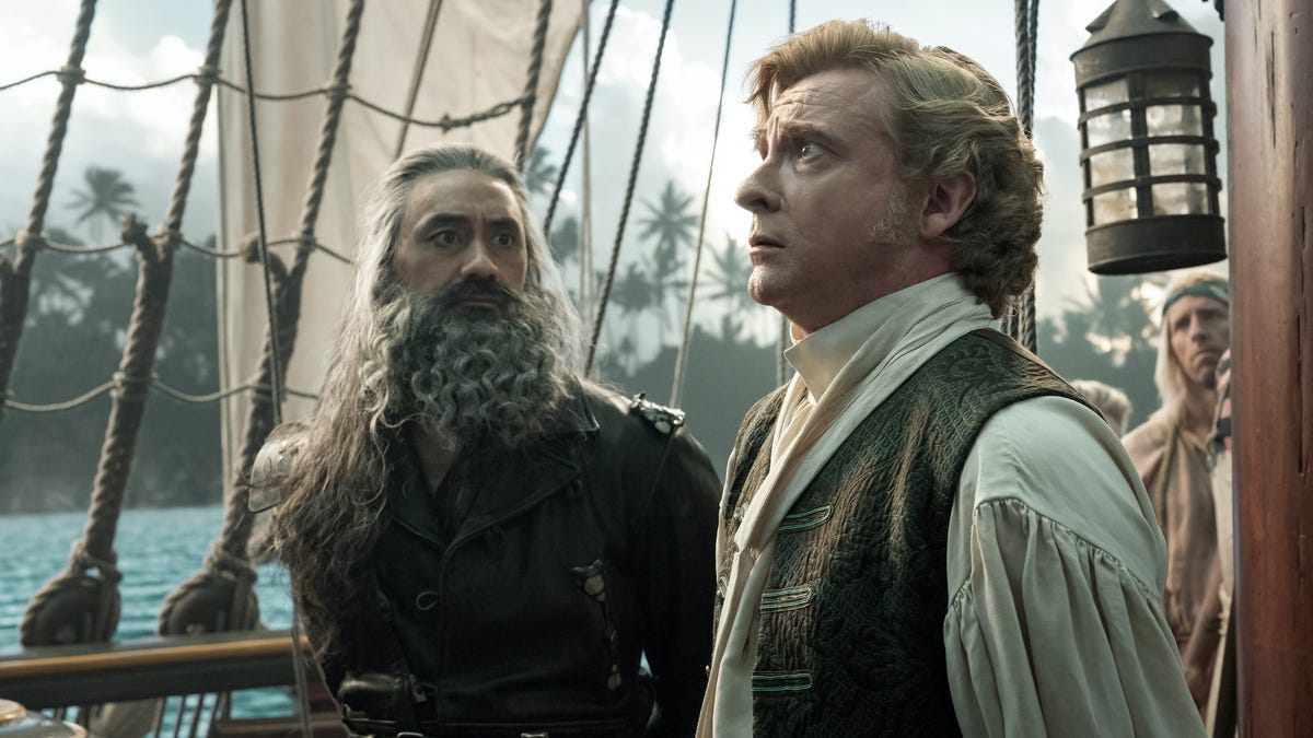 Taika Waititi and Rhys Darby in full pirate garb on a ship