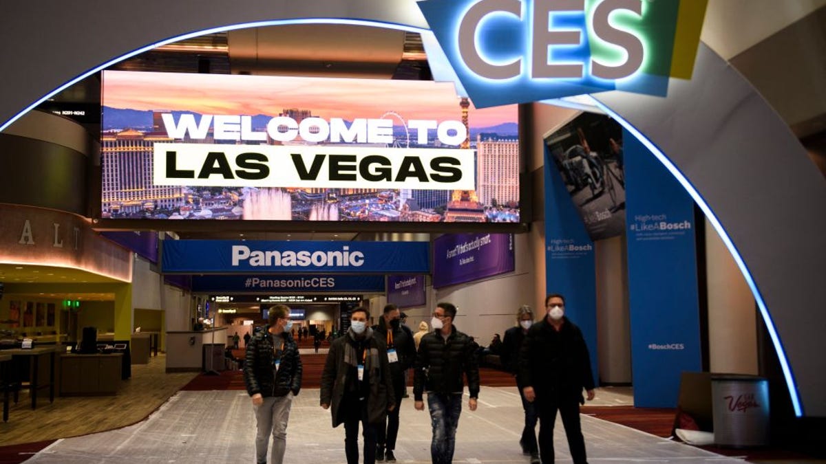 An image of attendees in front of the CES sign.