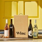 4 bottles of wine and winc box on doorstep