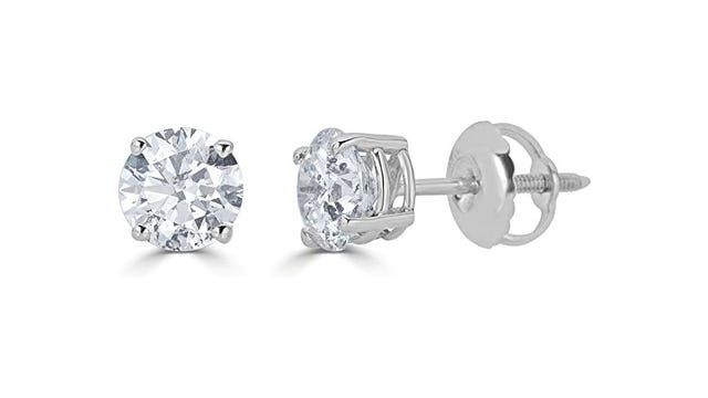Diamond earrings on a white background with silver fittings.
