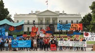 Climate protestors outside the White House in October 2021.
