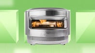 The Pi Pizza Oven from Solo Stove is displayed against a green background.