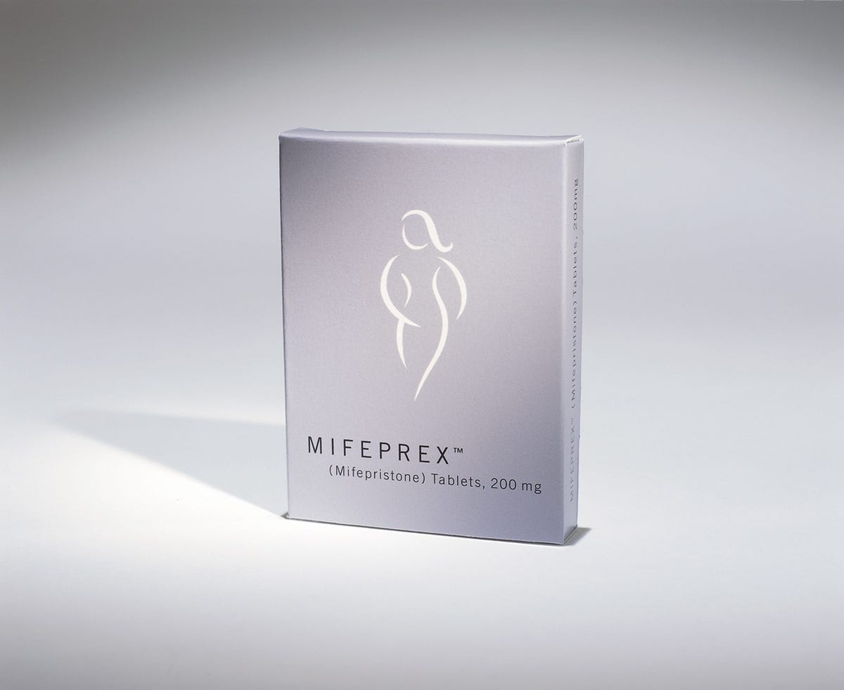 A box of Mifeprex with a sketched image of a woman.