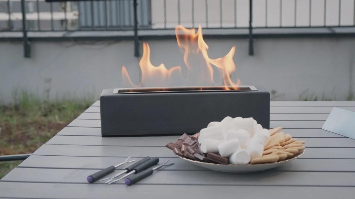 Houswise fire pit on an outdoor table with smores