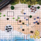 A beach battle map with dice and miniatures on it