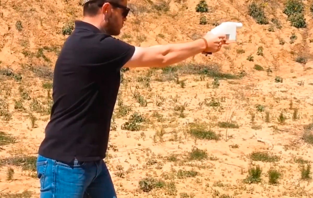 Cody Wilson fires his 3D-printed handgun, the Liberator