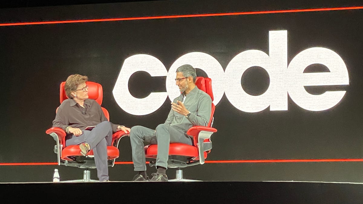 Kara Swisher, left, chats with Google CEO Sundar Pichai, right, both seated in the Code Conference&apos;s iconic red chairs.