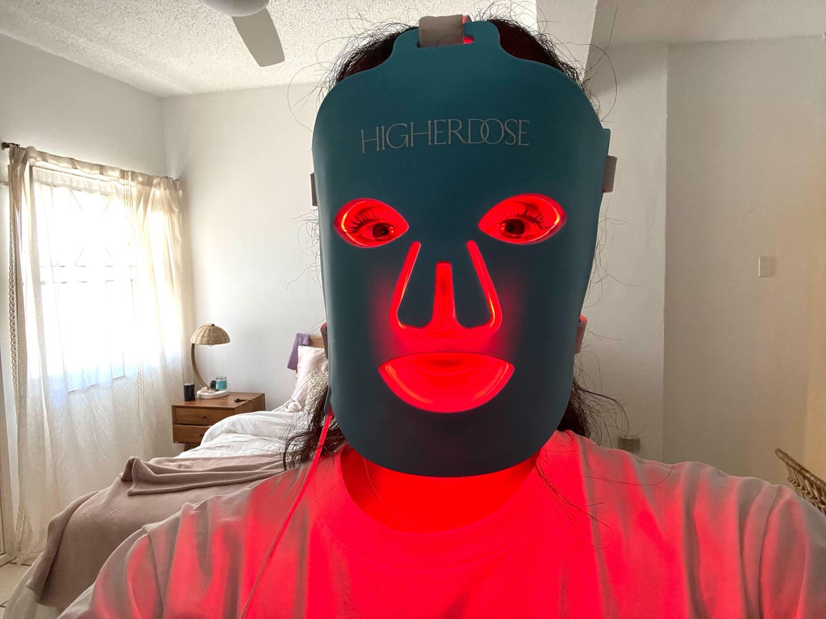 Nasha wearing a HigherDOSE LED face mask
