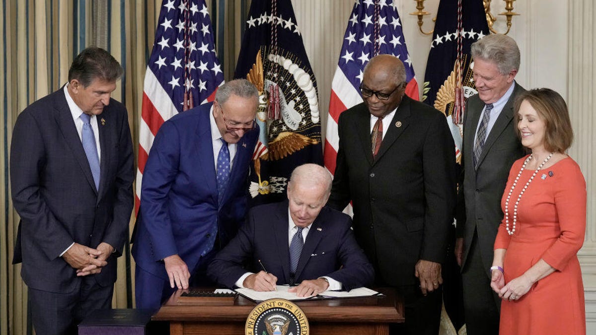 President Biden signing Inflation Reduction Act